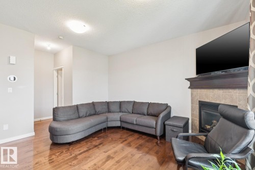 #12 18230 104A St Nw, Edmonton, AB - Indoor Photo Showing Living Room With Fireplace
