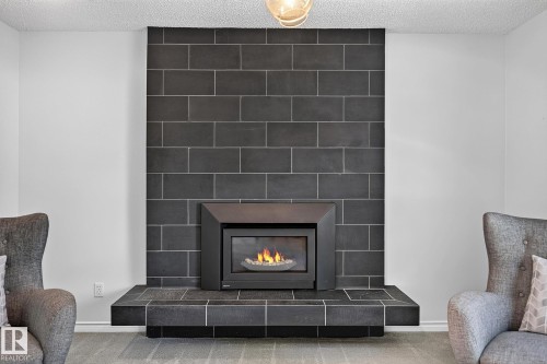 7707 156 Street Nw, Edmonton, AB - Indoor Photo Showing Living Room With Fireplace