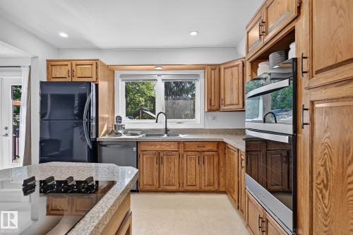 7707 156 Street Nw, Edmonton, AB - Indoor Photo Showing Kitchen With Double Sink