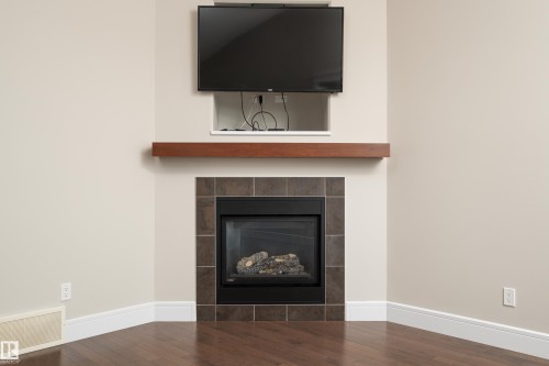65 Lakewood Boulevard, Beaumont, AB - Indoor Photo Showing Living Room With Fireplace