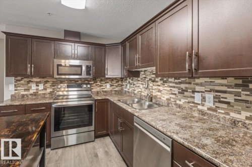 #116 9910 107 St, Morinville, AB - Indoor Photo Showing Kitchen With Double Sink With Upgraded Kitchen