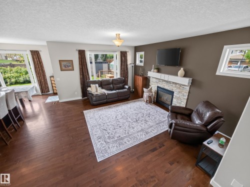 5718 42 Street, Beaumont, AB - Indoor Photo Showing Living Room With Fireplace