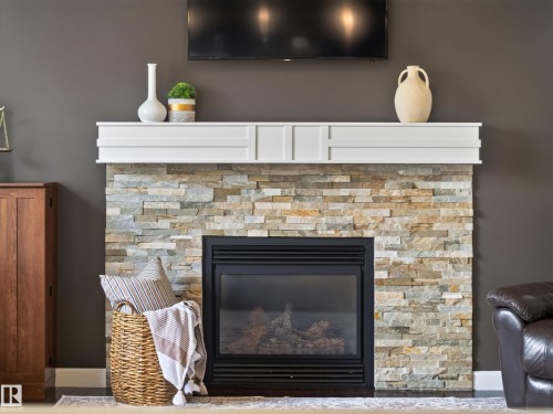 5718 42 Street, Beaumont, AB - Indoor Photo Showing Living Room With Fireplace