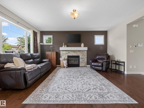 5718 42 Street, Beaumont, AB - Indoor Photo Showing Living Room With Fireplace
