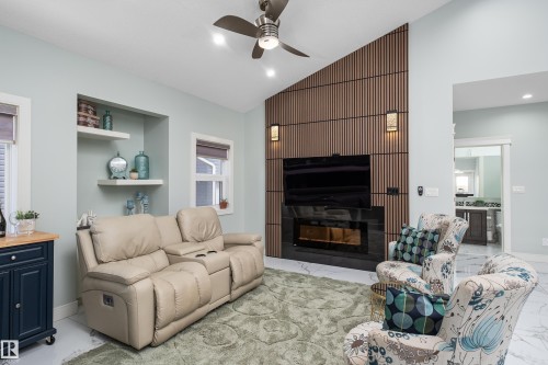 18 Lakevista Point(E), Beaumont, AB - Indoor Photo Showing Living Room With Fireplace