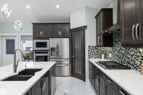 18 Lakevista Point(E), Beaumont, AB - Indoor Photo Showing Kitchen With Double Sink With Upgraded Kitchen