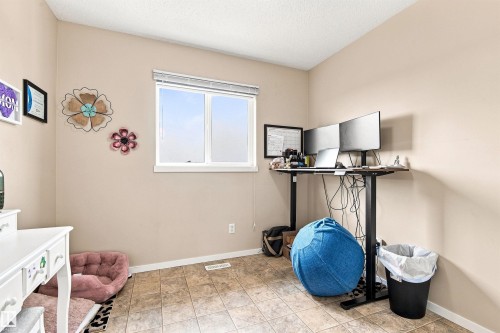 Neutral wall paint, tiled flooring, white trim, and a window with blinds - 204 59 Street Sw, Edmonton, AB - Indoor