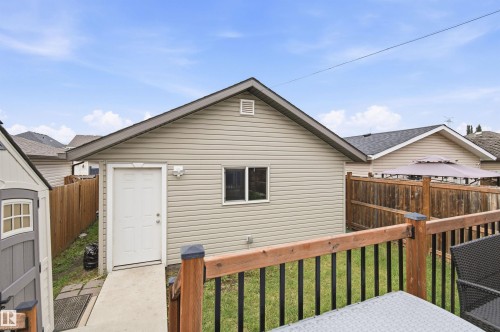 Detached garage with siding exterior and a single entry door - 204 59 Street Sw, Edmonton, AB - Outdoor With Exterior