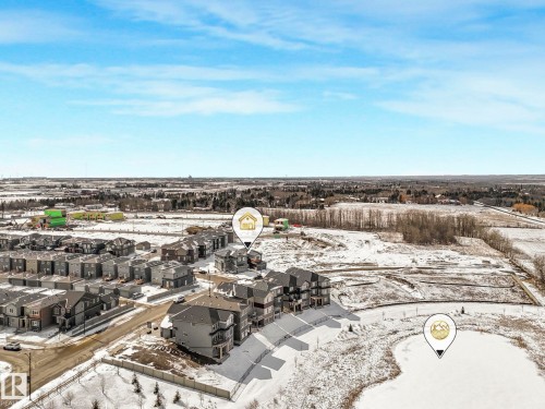 Aerial perspective showcasing a residential development with varied housing styles - 239 Kinglet Boulevard Nw, Edmonton, AB - Outdoor With View