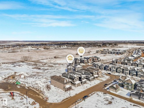 Aerial perspective of a developing residential area with extensive open land bordering the community - 239 Kinglet Boulevard Nw, Edmonton, AB - Outdoor With View