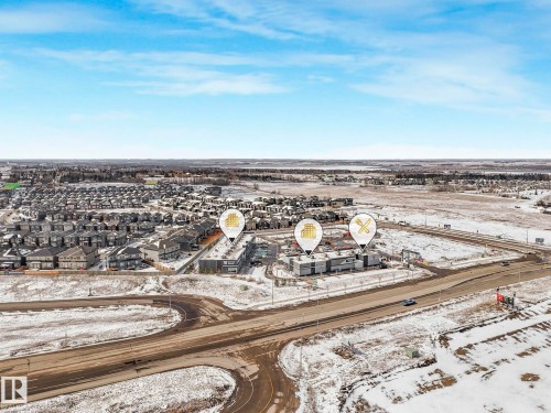 Aerial perspective showcasing a residential and commercial district - 239 Kinglet Boulevard Nw, Edmonton, AB - Outdoor With View