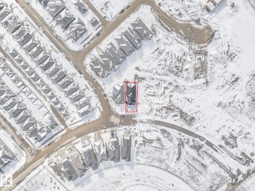 Aerial overview showcasing a residential property with a dark-toned roof, situated within a developed neighborhood with numerous similar homes - 239 Kinglet Boulevard Nw, Edmonton, AB - 