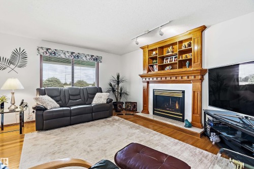115 Aspen Ridge Crescent, Wetaskiwin, AB - Indoor Photo Showing Living Room With Fireplace