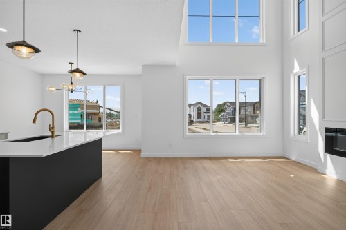 273 Paterson Link Sw, Edmonton, AB - Indoor Photo Showing Kitchen With Fireplace