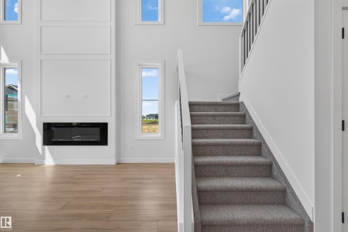 273 Paterson Link Sw, Edmonton, AB - Indoor Photo Showing Other Room With Fireplace