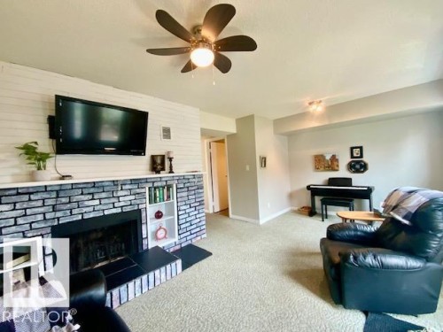 112 Centennial Drive, Wetaskiwin, AB - Indoor Photo Showing Living Room With Fireplace