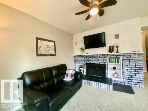 112 Centennial Drive, Wetaskiwin, AB - Indoor Photo Showing Living Room With Fireplace