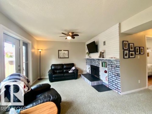 112 Centennial Drive, Wetaskiwin, AB - Indoor Photo Showing Living Room With Fireplace