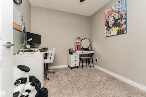 Neutral wall color, light carpet, and white trim - #310 2229 44 Av Nw, Edmonton, AB - Indoor Photo Showing Other Room
