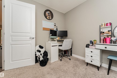 Light-colored carpeting with neutral-toned walls - #310 2229 44 Av Nw, Edmonton, AB - Indoor Photo Showing Office