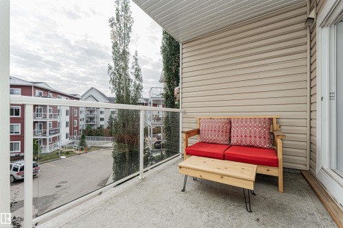 Private balcony with concrete flooring, glass railing, and durable siding - #310 2229 44 Av Nw, Edmonton, AB - Outdoor With Balcony With Exterior