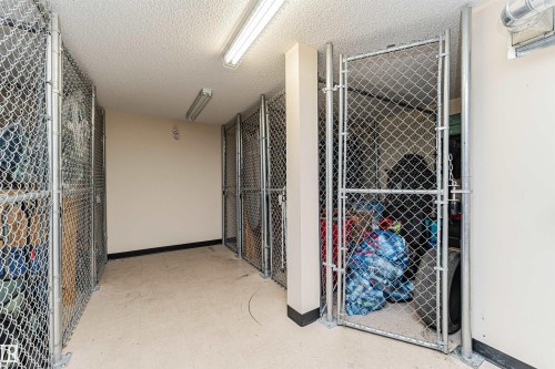 Dedicated storage units with chain-link construction and secure gate access - #310 2229 44 Av Nw, Edmonton, AB - Indoor Photo Showing Other Room