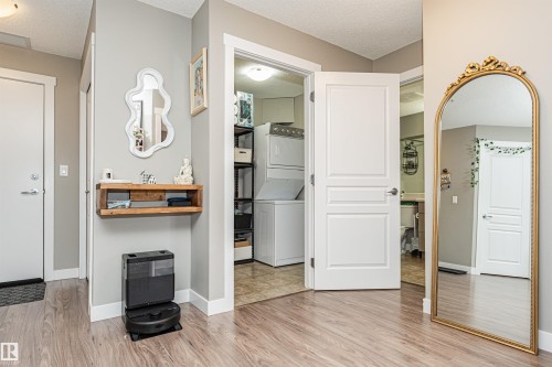 Wood-finish flooring throughout - #310 2229 44 Av Nw, Edmonton, AB - Indoor Photo Showing Other Room