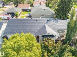 Dark-toned shingle roofing with multiple gables - 