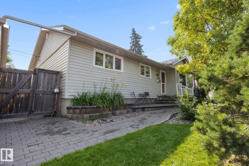 Light-colored siding exterior with white window frames - 9503 54 Street Nw, Edmonton, AB - Outdoor