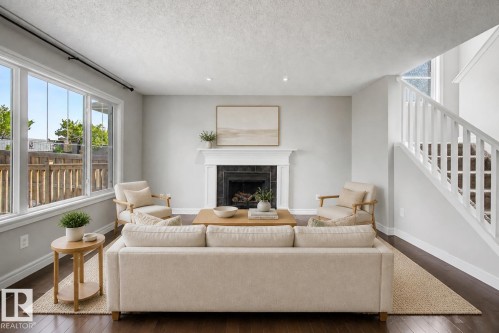 15868 10 Avenue Sw, Edmonton, AB - Indoor Photo Showing Living Room With Fireplace