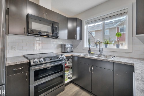 #58 9535 217 St Nw, Edmonton, AB - Indoor Photo Showing Kitchen With Stainless Steel Kitchen With Double Sink