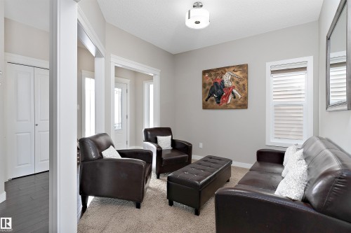 Abundant natural light from multiple windows - 1312 26 Avenue Nw, Edmonton, AB - Indoor Photo Showing Living Room
