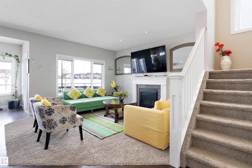 1312 26 Avenue Nw, Edmonton, AB - Indoor Photo Showing Living Room With Fireplace