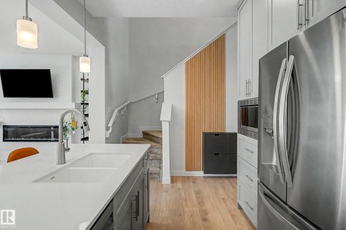 23015 96 Avenue Nw, Edmonton, AB - Indoor Photo Showing Kitchen With Stainless Steel Kitchen With Double Sink With Upgraded Kitchen
