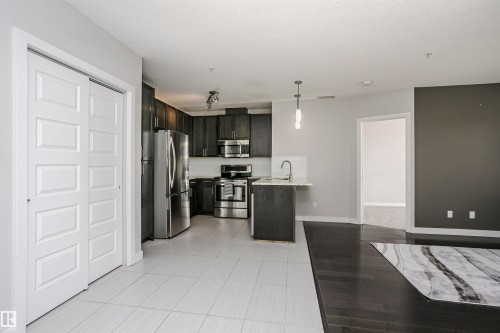 #229 5151 Windermere Bv Sw, Edmonton, AB - Indoor Photo Showing Kitchen With Stainless Steel Kitchen