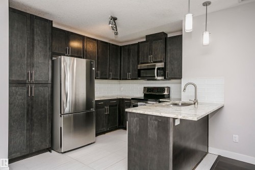 #229 5151 Windermere Bv Sw, Edmonton, AB - Indoor Photo Showing Kitchen With Stainless Steel Kitchen With Upgraded Kitchen