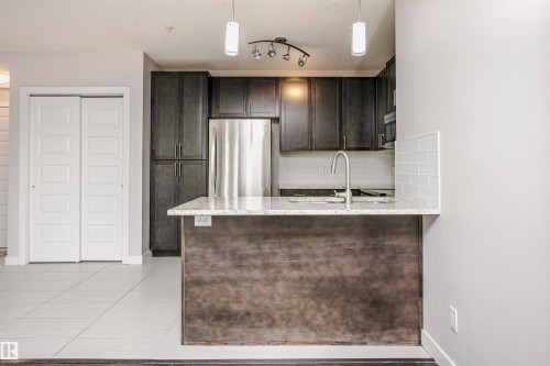 #229 5151 Windermere Bv Sw, Edmonton, AB - Indoor Photo Showing Kitchen With Stainless Steel Kitchen
