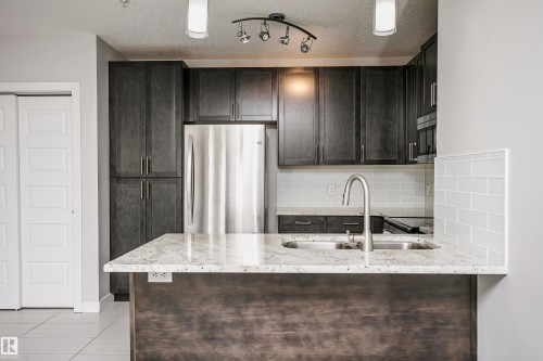 #229 5151 Windermere Bv Sw, Edmonton, AB - Indoor Photo Showing Kitchen With Double Sink With Upgraded Kitchen