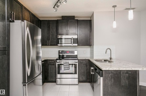 #229 5151 Windermere Bv Sw, Edmonton, AB - Indoor Photo Showing Kitchen With Stainless Steel Kitchen With Double Sink With Upgraded Kitchen