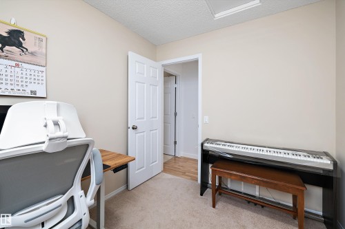 Neutral-toned walls complement the carpeted flooring - 3344 24 Avenue Nw, Edmonton, AB - Indoor