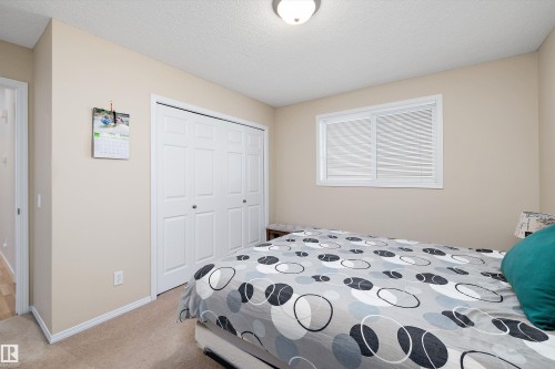 Bedroom featuring neutral wall paint, white trim, and carpet flooring - 3344 24 Avenue Nw, Edmonton, AB - Indoor Photo Showing Bedroom