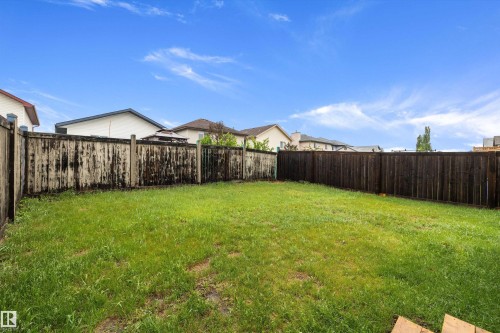 Expansive green space featuring perimeter fencing - 3344 24 Avenue Nw, Edmonton, AB - Outdoor