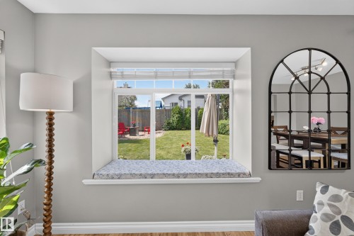 Window with a deep sill and a backyard with a manicured lawn - #25 200 Erin Ridge Dr, St. Albert, AB - Indoor