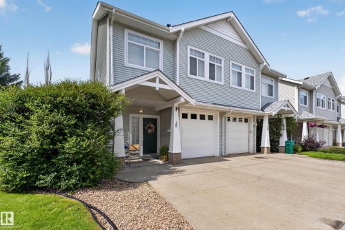 Light blue siding exterior with white trim and multiple windows - #25 200 Erin Ridge Dr, St. Albert, AB - Outdoor With Facade
