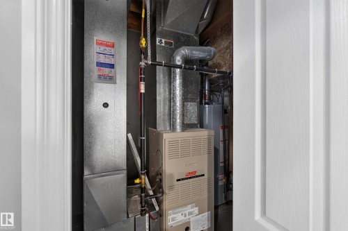 Furnace and water heater system - #25 200 Erin Ridge Dr, St. Albert, AB - Indoor Photo Showing Basement