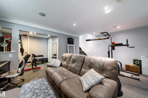 Recessed ceiling lighting illuminates a carpeted room with light grey walls - 7239 21 Avenue Sw, Edmonton, AB - Indoor Photo Showing Other Room
