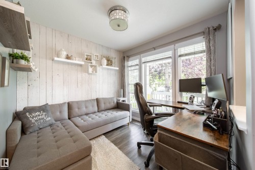 Wood-finish flooring, recessed lighting, and a window with blinds - 7239 21 Avenue Sw, Edmonton, AB - Indoor