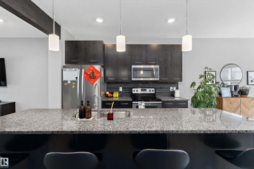 15927 13 Avenue Sw, Edmonton, AB - Indoor Photo Showing Kitchen With Upgraded Kitchen