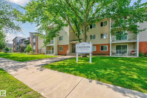 Welcome to Westmark Apartments, a well-appointed residential community featuring multi-unit architecture with contemporary mixed-material exteriors combining brick and fiber cement siding - #206 10842 107 St Nw, Edmonton, AB - Outdoor