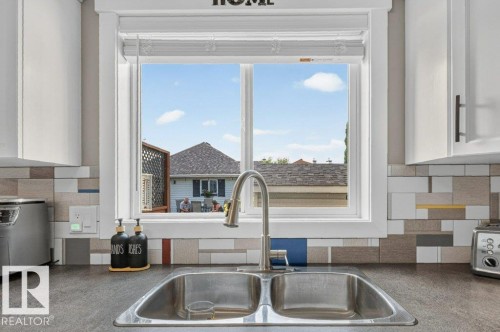 Stainless steel double basin sink with a gooseneck faucet - 5322 Terwillegar Boulevard Nw, Edmonton, AB - Indoor Photo Showing Kitchen With Double Sink